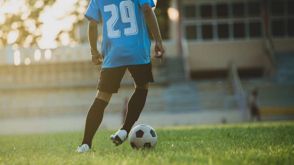 soccer player action stadium 1 scaled e1780521349195