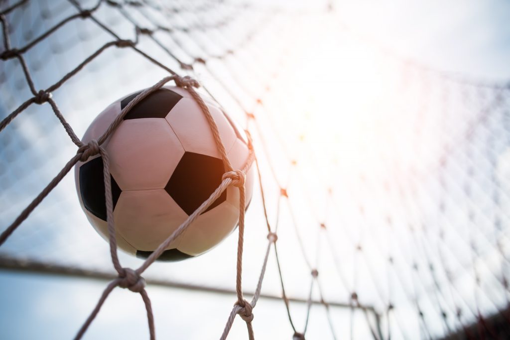 soccer into goal success concept